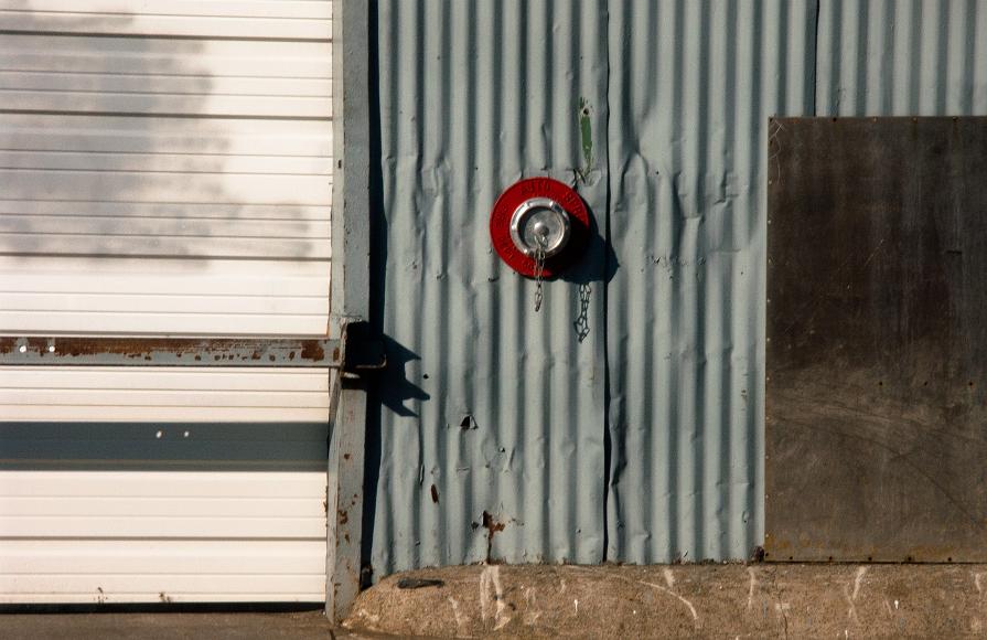 Detail behind Union Square Somerville MA Wall with door and gate corrugated metal