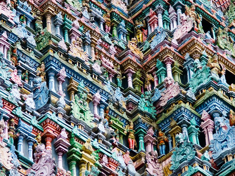 Detail of decorations on the Meenakshi Amman Temple multicolored painted gods and goddesses from indian culture, portrayed in rows on the stu