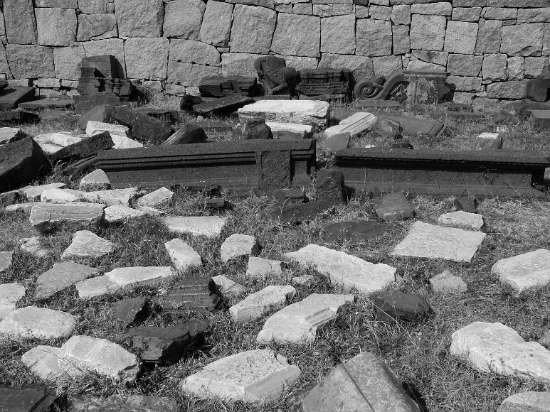 The scattered stones slabs of excavated ruined palaces at Hampi in India
