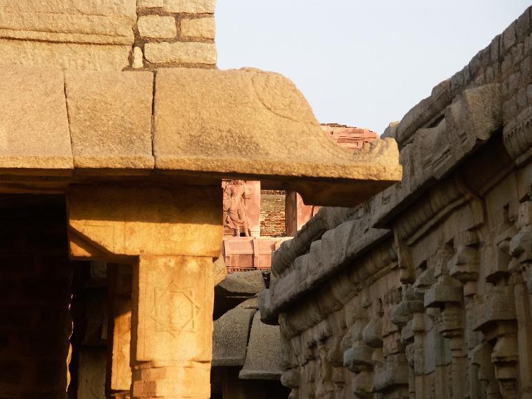 Four layers of stone carvings different layers of stone temples juxtaposed against each other at temples in the vijayanagar empire ruins at hampi india