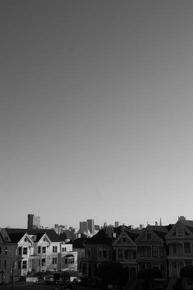 SF Skyline at sunset in black and white Full House Houses as well as a Catholic Church and downtown buildings along with Russian and Telegraph Hill buildings in San Francisco, CA