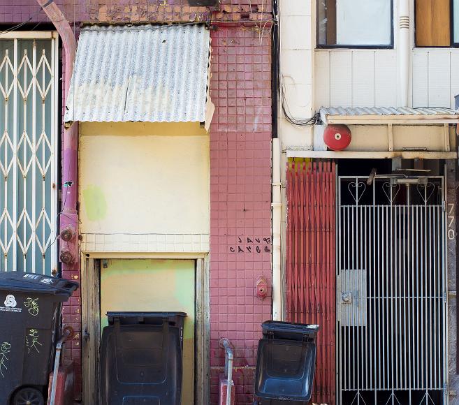 Chinatown doorways Gates doorways and garbage cans along a Chinatown side street in San Francisco