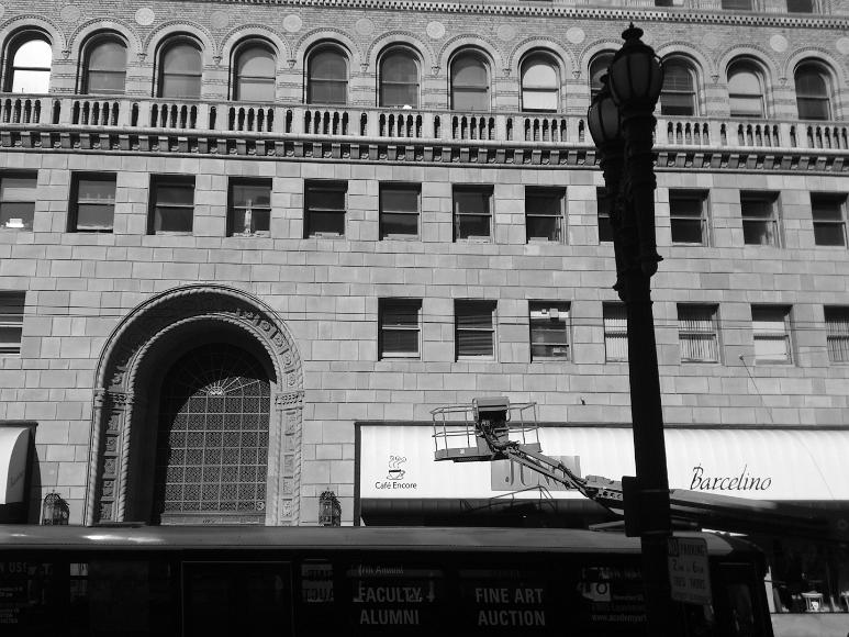 Union Square street scene decadence Black and white of a street scene near Union Square and an Academy of Art Building with a lift and detailed silhouetted lamposts