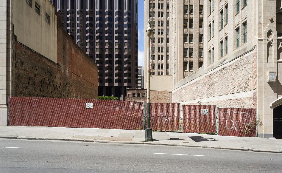 Future home of something big An empty fenced lot surrounded by very tall skyscrapers in the area between rincon hill and the financial district and SOMA