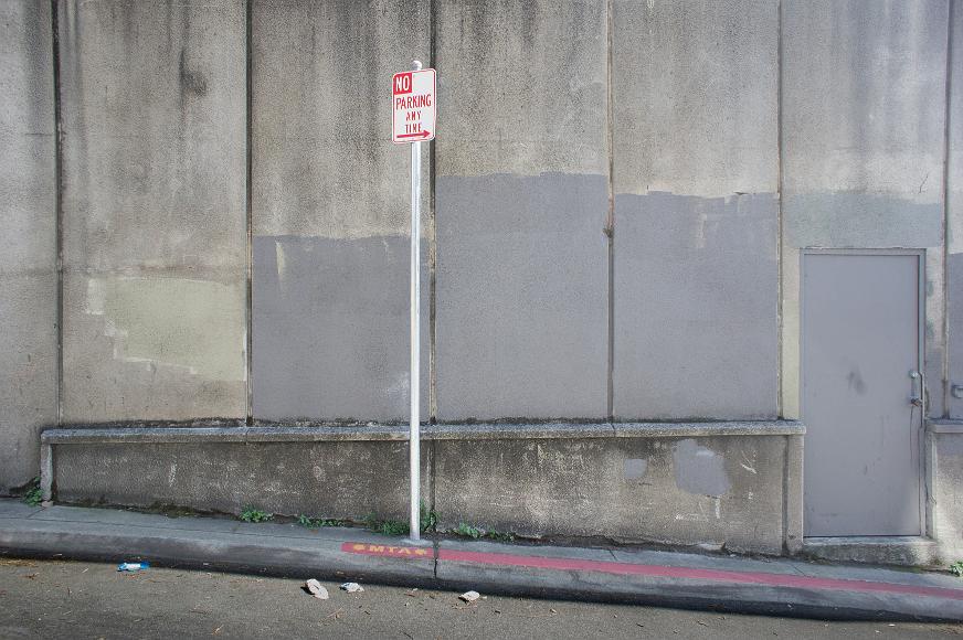 Painted over street scene on Russian Hill Very gray street scene at an MTA bus stop angled down