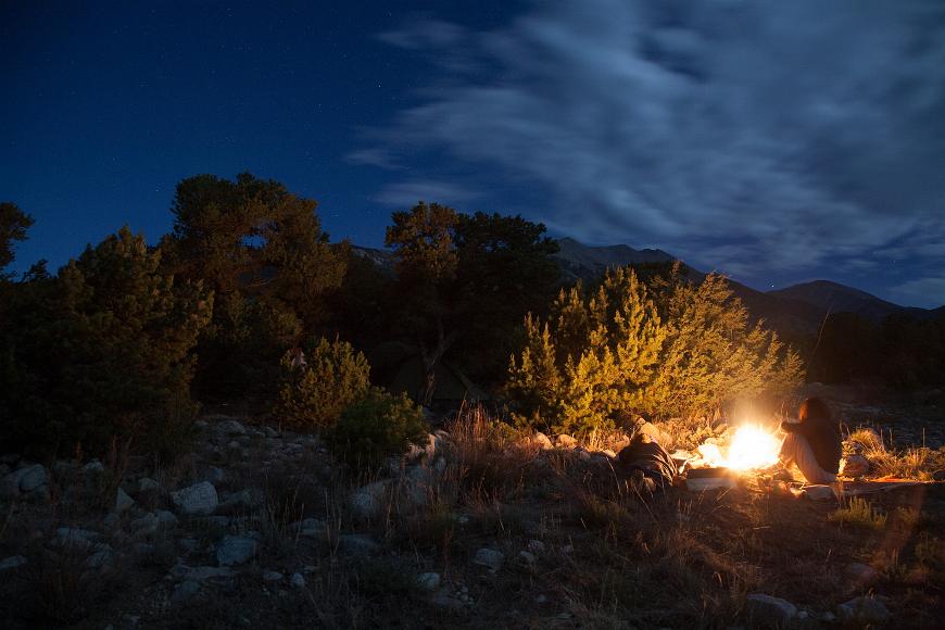 Ginger and Sandy by the fire on my land near Mt. Blanca in Colorado