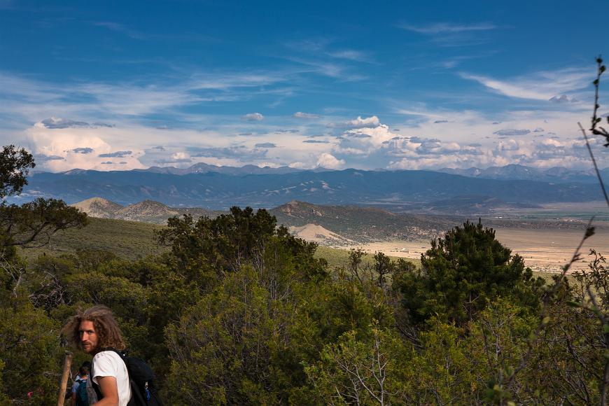 Kyle looks out from the woods above the San Luis Valley in Colorado