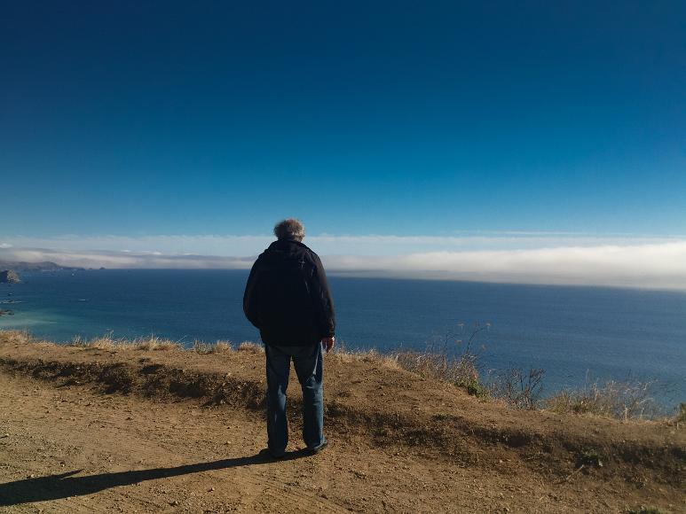 Ashoke by the water Dad looks from a dirt cliff back south at the Pacific Coastline