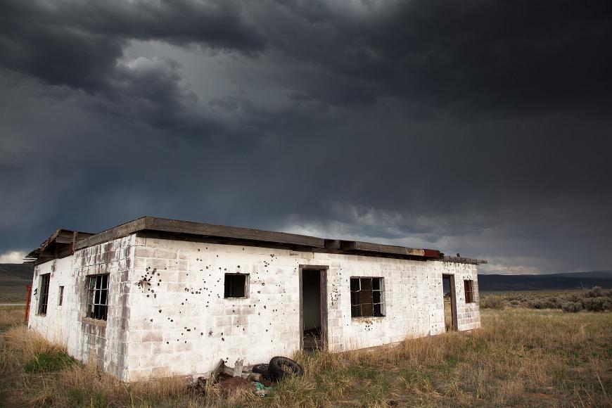 Old Concrete shack under cloudy skies in southern Colorado