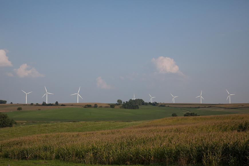 Windmills turn over farmers corn and soy fields