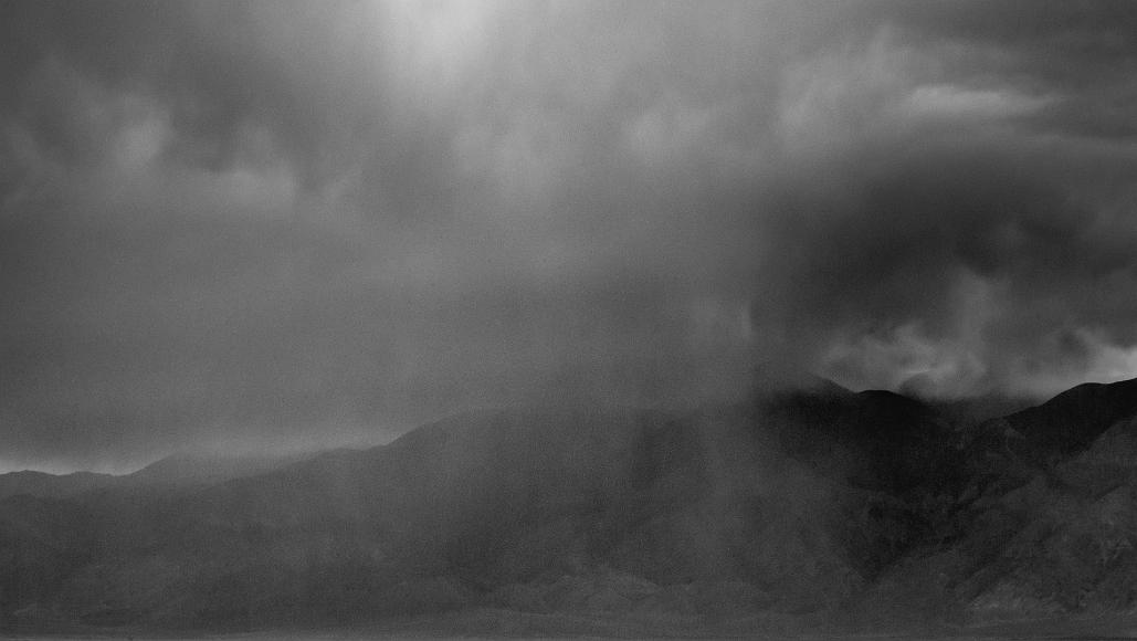 Desert Rainstorm Black and white of rain falling onto dry desert mountains