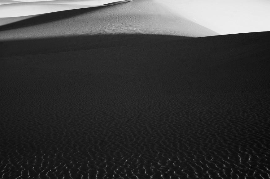White Sands 2012 09 Black and White gypsum sand dunes underneath with sunlit ripples in the foreground fading to shaded ripples and sunlight elsewhere in White Sands National...