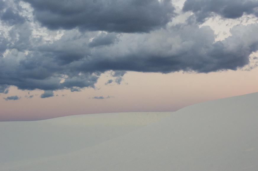 White Sands 2012 10 White gypsum sand dunes underneath a pink and purple dusk sky studded with clouds in White Sands National Monument in New Mexico