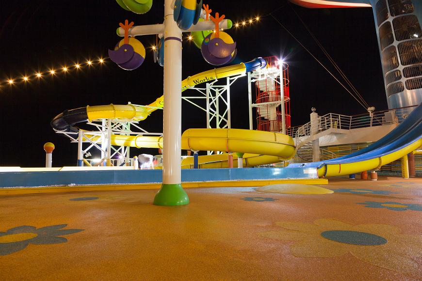 Waterslide on a cruise ship at night Waterslides and colored floors in the waterpark area of a Carnival cruise ship at night
