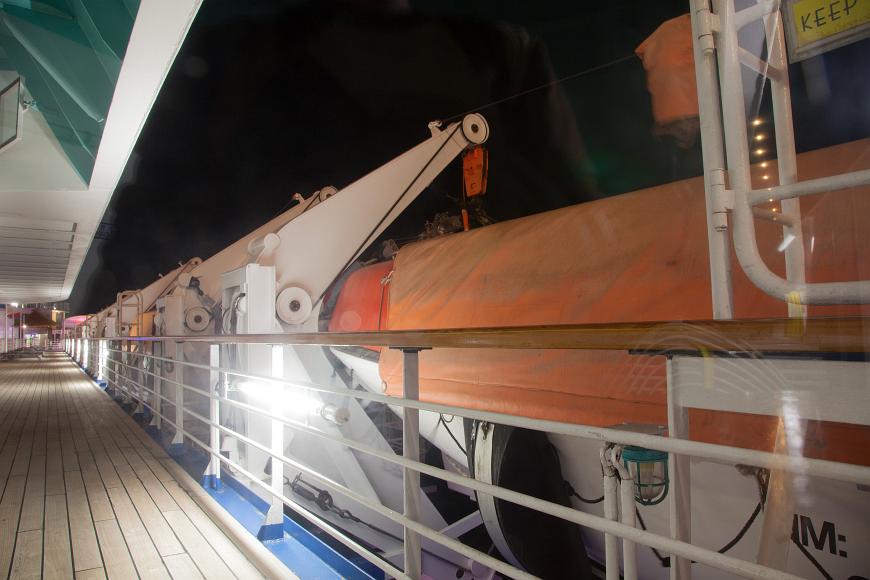 Deck and lifeboats On a cruise ship deck at night off florida carnival cruises