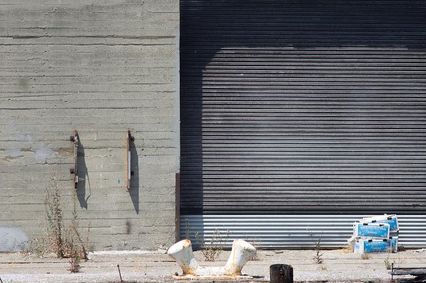 San Francisco Pier Detail #9 boxes and corrugated metal door with concrete wall and disintegrating dock