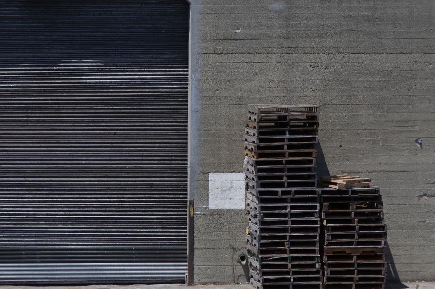 San Francisco Pier Detail #15 Metal door wooden crates and concrete wall